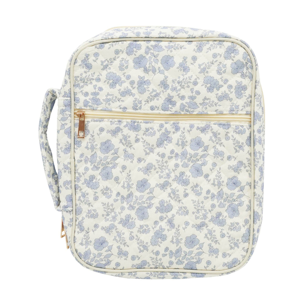 Floral-patterned bag with a gold zipper on a white background