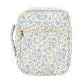 Floral-patterned bag with a gold zipper on a white background