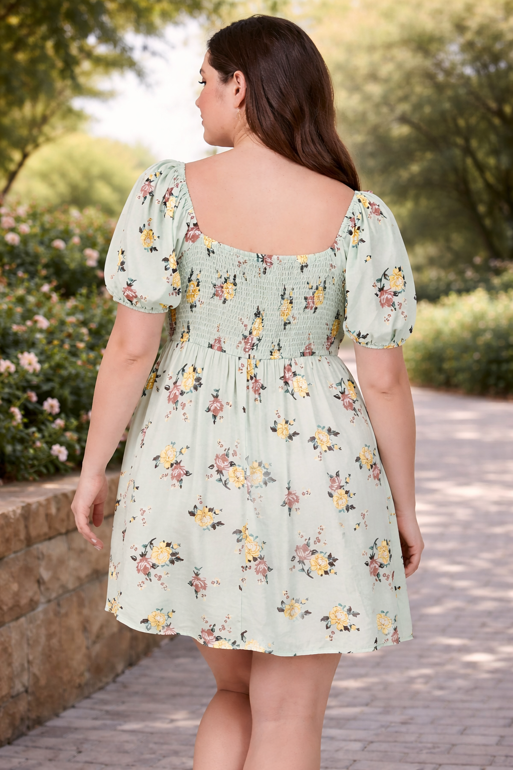 Woman wearing a floral dress in an outdoor setting